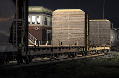 bulkhead flatcars pass in front of XO Tower