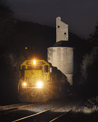 Train passing under an abandoned coaling tower