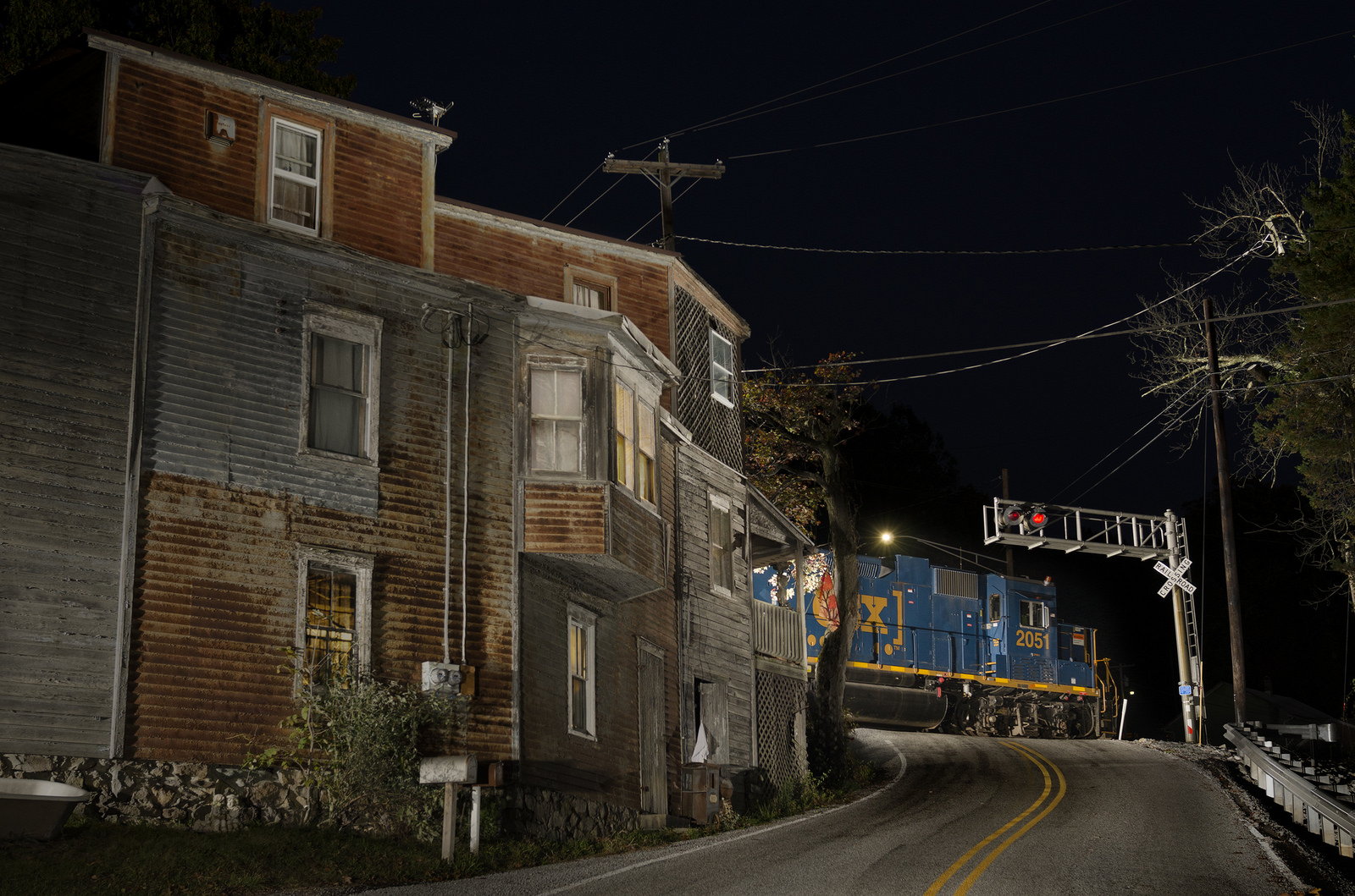 CSX GP38-3 passes behind Gladhill's store and postoffice