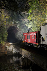 Caboose exiting a tunnel