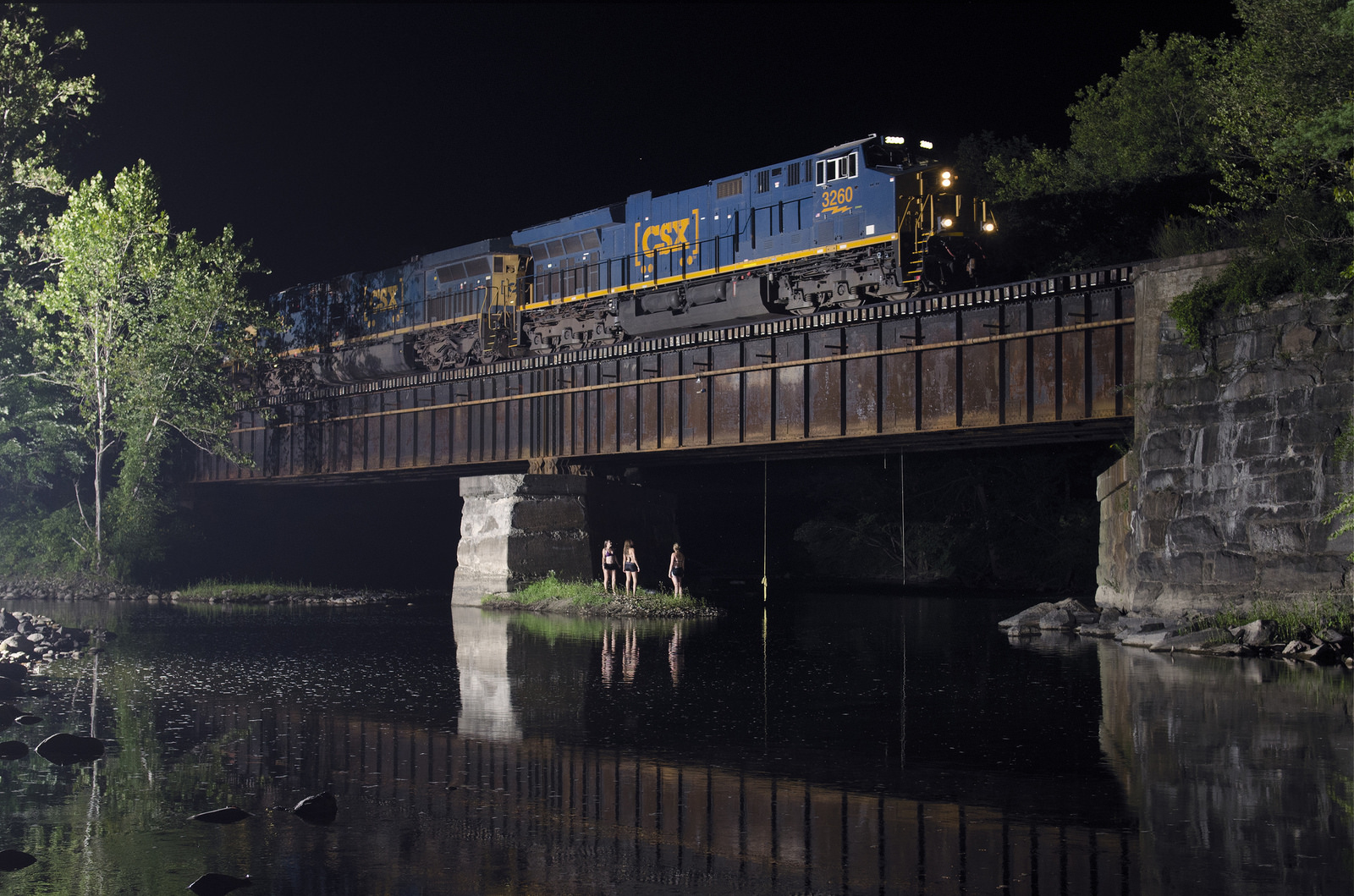nightswimming under a train bridge