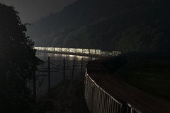 a train snakes along the Hudson River